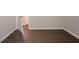 This bedroom features modern flooring and has a view to an adjoining room at 2311 Cherry Blossom Sw Dr, Atlanta, GA 30331
