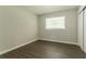 This bedroom features modern flooring, ample closet space and a large window at 2311 Cherry Blossom Sw Dr, Atlanta, GA 30331