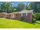 Charming brick ranch home on a large lot with mature trees and green grass at 2311 Cherry Blossom Sw Dr, Atlanta, GA 30331