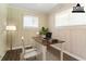 Bright home office features a modern desk, wood-look flooring and light wood-paneled walls at 2311 Cherry Blossom Sw Dr, Atlanta, GA 30331