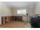 Kitchen featuring damage to the lower walls and an older appliance at 2311 Cherry Blossom Sw Dr, Atlanta, GA 30331