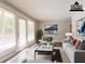 Staged living room featuring french doors, neutral paint, and modern decor at 2311 Cherry Blossom Sw Dr, Atlanta, GA 30331