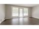 Living room with hardwood floors, neutral walls, and access to the patio at 2311 Cherry Blossom Sw Dr, Atlanta, GA 30331