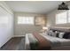 The main bedroom features modern flooring, closet and large window overlooking the yard at 2311 Cherry Blossom Sw Dr, Atlanta, GA 30331
