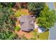 Aerial view showing the home's roof, deck, driveway, landscaping and the surrounding area at 3095 Willow Park Dr, Dacula, GA 30019