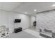 Finished basement with seating and a small play kitchen at 3095 Willow Park Dr, Dacula, GA 30019