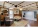 Finished basement with unique ceiling design, wood paneling, and comfortable seating at 3095 Willow Park Dr, Dacula, GA 30019