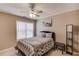 Bedroom with a ceiling fan, natural light, and a comfortable bed at 3095 Willow Park Dr, Dacula, GA 30019