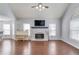 Spacious living room with vaulted ceiling, fireplace, and abundant natural light from large windows at 3095 Willow Park Dr, Dacula, GA 30019