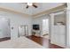 Cozy bedroom features a trey ceiling, an ensuite bathroom, and ample natural light at 3095 Willow Park Dr, Dacula, GA 30019