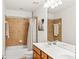 Bathroom featuring double sinks and a shower-tub combo at 450 Hammersmith Dr, Suwanee, GA 30024