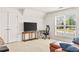 Bonus room features a large window, and a comfortable seating area at 450 Hammersmith Dr, Suwanee, GA 30024