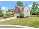 Well-maintained home showcasing a landscaped front yard and inviting curb appeal at 450 Hammersmith Dr, Suwanee, GA 30024