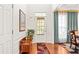 Elegant foyer with hardwood floors, natural light, and stylish decor at 450 Hammersmith Dr, Suwanee, GA 30024