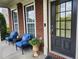 Cozy front porch with seating, perfect for enjoying the outdoors at 450 Hammersmith Dr, Suwanee, GA 30024