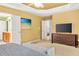 Main bedroom featuring a tv on a dresser, an ensuite, and neutral decor at 450 Hammersmith Dr, Suwanee, GA 30024