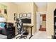 Bright office area with desk, ergonomic chair, and wall art at 450 Hammersmith Dr, Suwanee, GA 30024