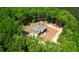 Aerial view of house surrounded by a dense forest, offering privacy and a natural setting at 60 Browning Shoals Rd, Social Circle, GA 30025