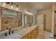 Bathroom boasts double sinks, granite countertops, and a luxurious brick shower at 60 Browning Shoals Rd, Social Circle, GA 30025