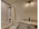 This updated bathroom includes a tub, shower, granite vanity, and updated lighting at 60 Browning Shoals Rd, Social Circle, GA 30025