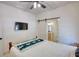 Bedroom showcasing a sliding barn door, a ceiling fan, and wall-mounted television at 60 Browning Shoals Rd, Social Circle, GA 30025