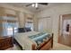Bright bedroom features a ceiling fan, plush carpeting, and natural light at 60 Browning Shoals Rd, Social Circle, GA 30025