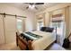 Bedroom featuring a sliding barn door, a queen bed, and bright natural light at 60 Browning Shoals Rd, Social Circle, GA 30025