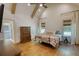Bright bedroom with vaulted ceilings, wooden beams, and large windows with a view at 60 Browning Shoals Rd, Social Circle, GA 30025