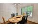 Dining room with decorative light fixture and a view of the outside at 60 Browning Shoals Rd, Social Circle, GA 30025
