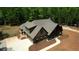 An exterior elevation showing a stunning home with a spacious front porch and well-manicured landscaping at 60 Browning Shoals Rd, Social Circle, GA 30025