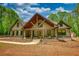 Charming craftsman-style home with a welcoming front porch and attractive wooden design elements at 60 Browning Shoals Rd, Social Circle, GA 30025