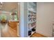 An open concept kitchen with modern appliances, wood floors and a view to the outside at 60 Browning Shoals Rd, Social Circle, GA 30025
