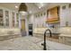 Well-appointed kitchen featuring granite countertops, a stainless steel stove, and custom cabinetry at 60 Browning Shoals Rd, Social Circle, GA 30025