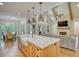 Bright kitchen with granite island, stainless appliances, and seamless flow to the dining and living spaces at 60 Browning Shoals Rd, Social Circle, GA 30025