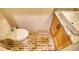Charming powder room features brick flooring and a wood vanity with a white sink at 60 Browning Shoals Rd, Social Circle, GA 30025