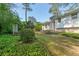 Spacious backyard with lush greenery, a well-manicured lawn, and a tranquil garden area at 723 Monticello Se Way, Marietta, GA 30067