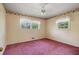 An empty bedroom featuring carpeted floor, and two windows offering natural light at 723 Monticello Se Way, Marietta, GA 30067
