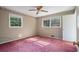 Empty bedroom with two windows, neutral walls, with carpet flooring and plenty of sunlight at 723 Monticello Se Way, Marietta, GA 30067