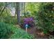 A lush, well-maintained garden featuring colorful flowers, shrubs, and a decorative blue gazing ball at 723 Monticello Se Way, Marietta, GA 30067