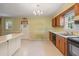 Functional kitchen with tile flooring, wood cabinets and stainless steel double sink at 723 Monticello Se Way, Marietta, GA 30067