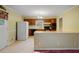 Functional kitchen with tile flooring, black appliances, and an adjacent breakfast bar at 723 Monticello Se Way, Marietta, GA 30067