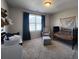 A tranquil Bedroom featuring soft lighting, a cozy crib, and comfortable seating at 1132 Red Bud Cir, Villa Rica, GA 30180