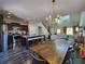 Modern kitchen featuring an island with seating, stainless appliances, and wood floors at 1132 Red Bud Cir, Villa Rica, GA 30180