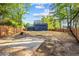 Spacious backyard with wooden fence providing privacy and a view of the home's exterior at 1554 Cardinal Rd, Jonesboro, GA 30238
