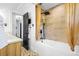Beautiful bathroom featuring modern fixtures, tiled walls, and a soaking tub at 1554 Cardinal Rd, Jonesboro, GA 30238