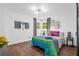 Cozy bedroom featuring vibrant bedding, modern lighting, and a warm ambiance at 1554 Cardinal Rd, Jonesboro, GA 30238