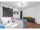 Stylishly decorated bedroom with colorful accents, wood floors and plenty of natural light at 1554 Cardinal Rd, Jonesboro, GA 30238