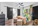Bright bedroom with colorful bedding, black sliding barn doors, and ample natural light at 1554 Cardinal Rd, Jonesboro, GA 30238