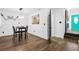 Cozy dining area with wood floors, modern lighting, and unique decor creates an inviting space at 1554 Cardinal Rd, Jonesboro, GA 30238