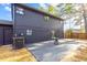Rear exterior view of a modern home with a patio and well-maintained yard at 1554 Cardinal Rd, Jonesboro, GA 30238